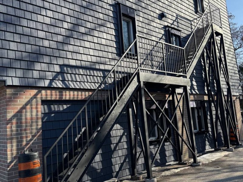 18-ft exterior fire-escape stair — Galvanized, attached to masonry wall