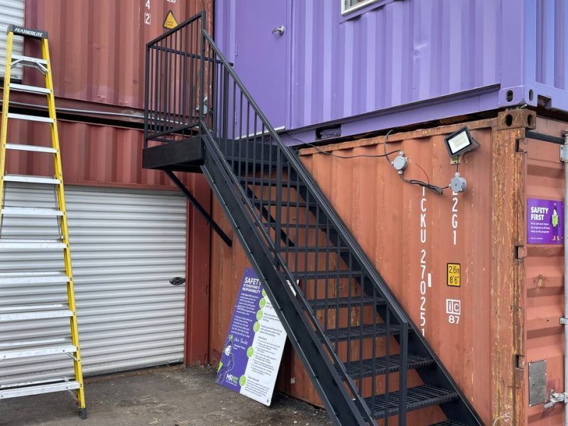 Switchback stair, 3 levels — Bar-grate, tube-rail, powder-coat